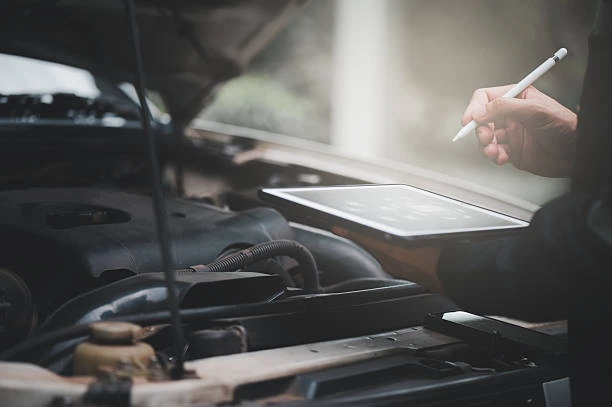 Technician performing a professional engine diagnostic inspection for fleet vehicle repair in Clinton, Utah, using digital tools to identify issues and reduce downtime.