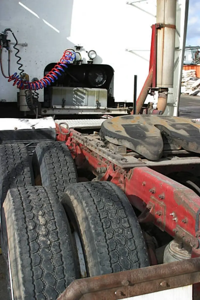 Rear view of a heavy-duty tractor showing fifth wheel and air brake lines, commonly inspected and serviced during fleet truck repair and diesel diagnostics.