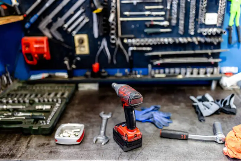 Fleetway mobile diesel mechanic using professional tools to diagnose and repair a work truck near Clinton, Utah.