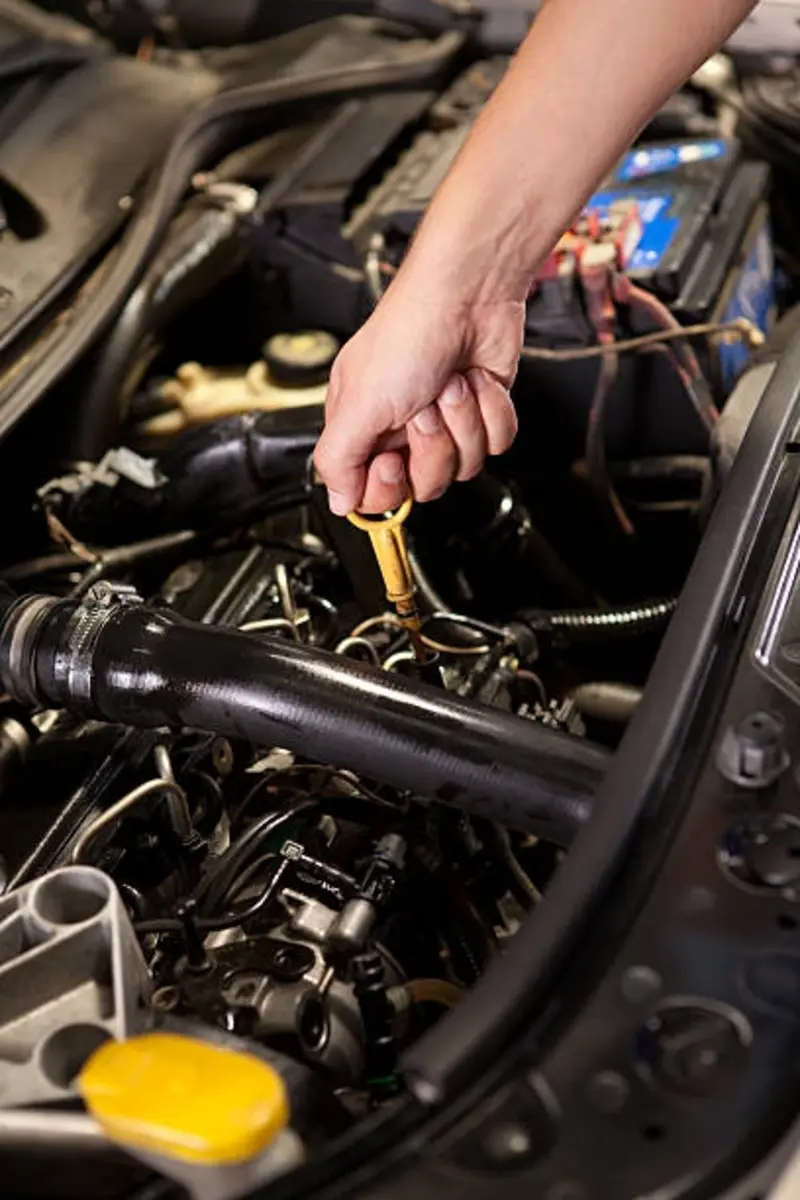 A fleetway mechanic checking the power stroke oil.